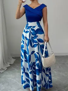 A sleeveless navy blue dress with blue and white leaf print panels and a V-neckline with a flared long skirt, suitable for occasions such as dinners, upscale dates, art exhibitions, Evening that require a polished