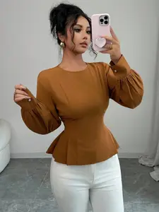 A women's caramel brown round-neck fitted crop top with ruffled hem and long sleeves. Elegant and retro style. Seams are tailored for a slim fit. Pearl decorations are on the cuffs. The hem features pleated design. Suitable for women who prefer light and