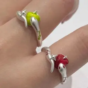 Green and red apple and snake couple ring