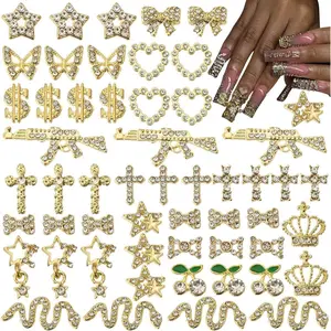 64 Pcs Gold Nail Charms and Gems Y2k Charms for Nails Design Metal Nail Jewels for Nail Art 3D Nail Bow Cherry Butterfly Star Cross Heart Money