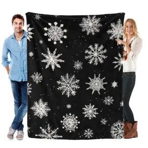 A minimalist black background covered with an array of delicate white and gray snowflakes in various intricate designs blanket ,gift for family, gift for friends, holiday gift