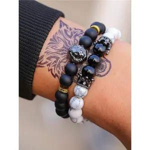 Set of 2 vintage beaded bracelets featuring a white turquoise lion head crown design with textured beads, boho jewelry for men, an elegant accessory that goes with everything