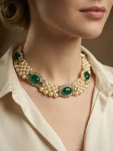 A vintage palace style multi-layered imitation pearl necklace with diamond and emerald accents, suitable for formal occasions such as dinners, weddings, or vintage outfits.