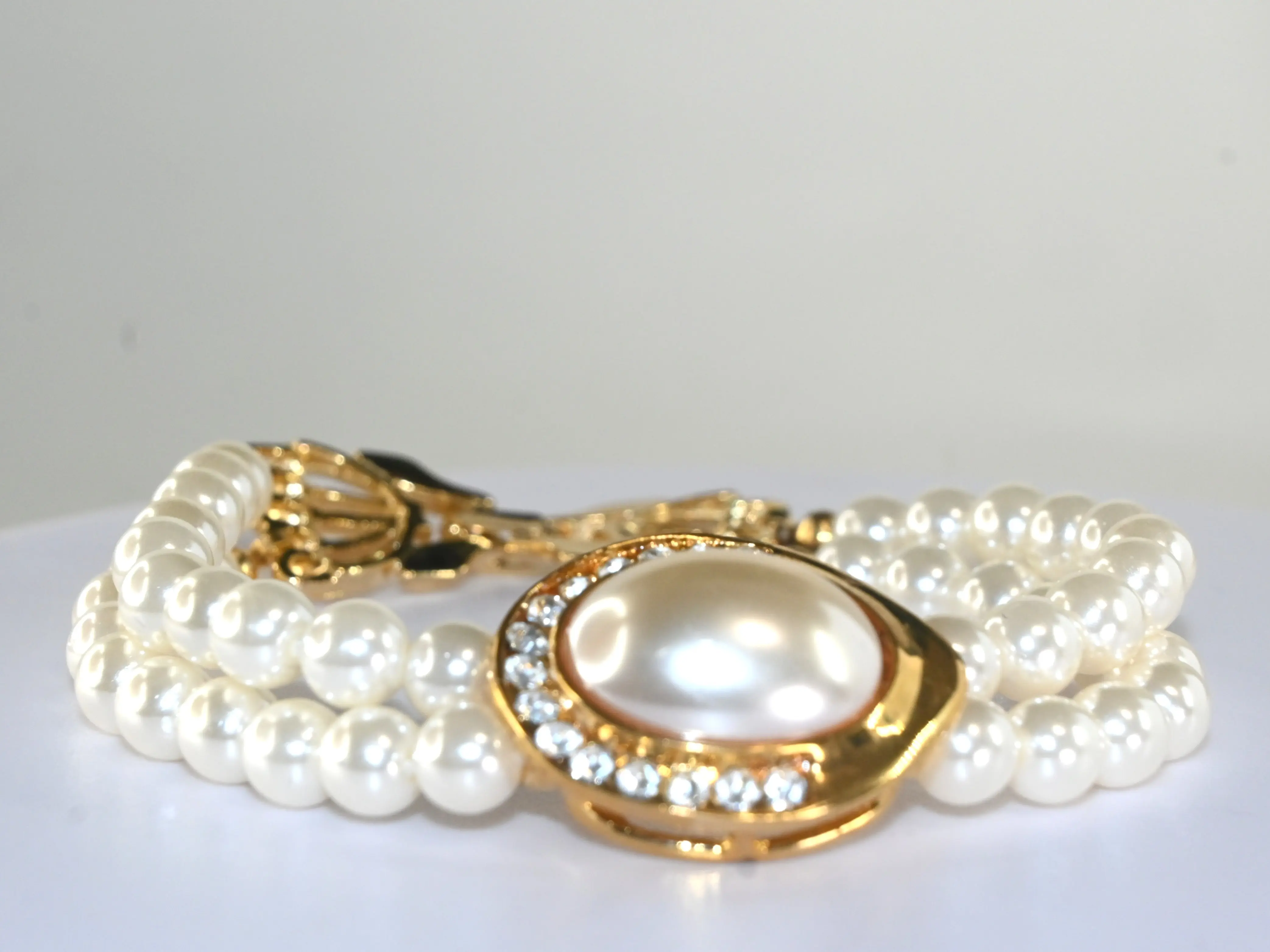 (TWWJ_B_D) Elegant Double-Strand Pearl Bracelet with Oval Center Pearl & CZ Halo Gold-Tone 6" Length for Weddings & Special Occasions