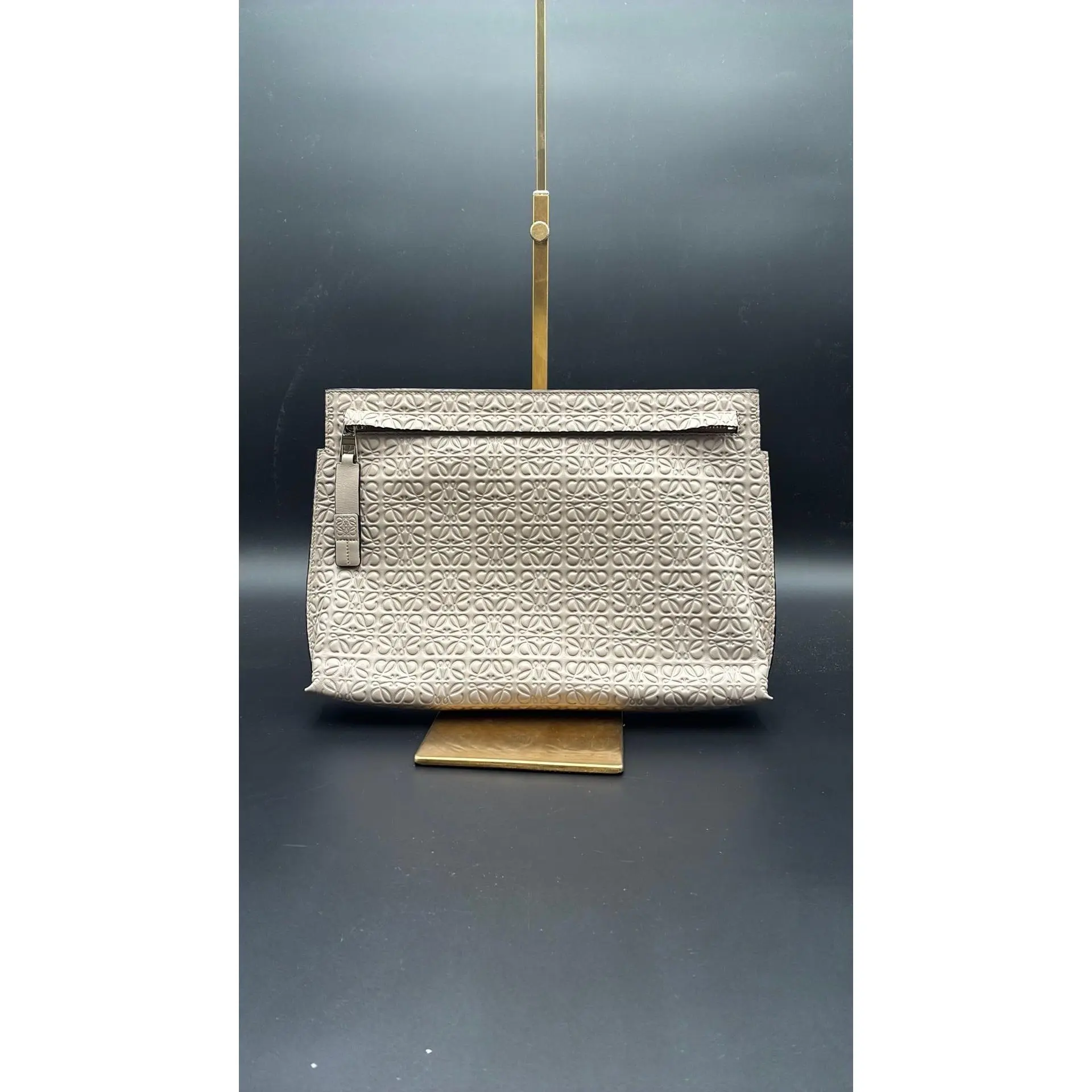 Pre-owned Leather Luxury Bags & Accessories Loewe Repeat T Pouch is Crafted, Beige Date Code: 521606. Entrupy ID: 947H66X. CHICAGO