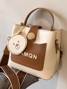 Reine Women's Mini Imported PU Leather Bucket Crossbody Bag with Animal Charm - Lightweight, Compact, Ideal for Everyday Use