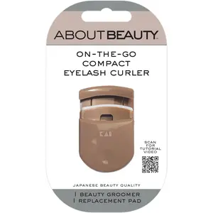 Compact Travel Eyelash Curler with Built-In Replacement Pad