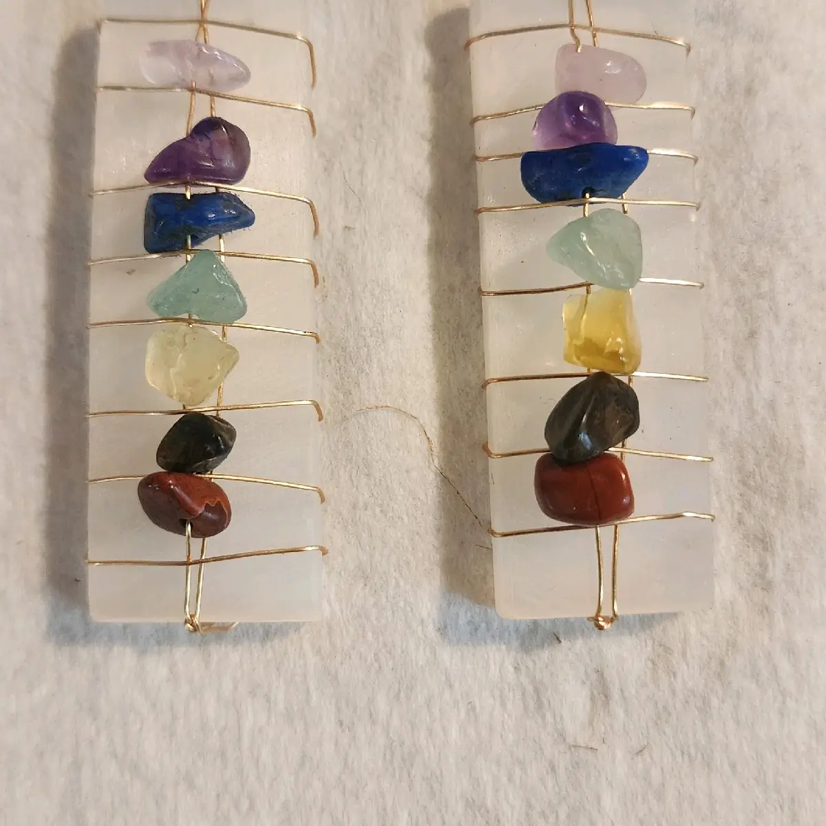 crystal chakra stones on selenite pendant