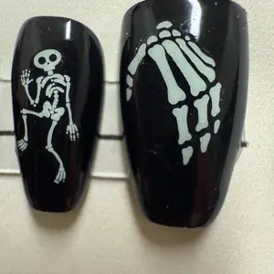 Halloween Nails with Glow-in-the-Dark Skeleton Design for Spooky Style