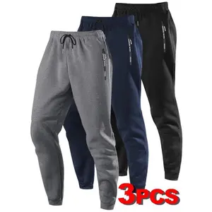 3-PackMen'sSolidColorSportsJoggers,withLetterPrintZipperPocketsandDrawstring-BreathablePolyesterBlend,All-SeasonFitnessCasualWear,All-SeasonJoggers|Sportyappearance|Smoothtexturedfabric