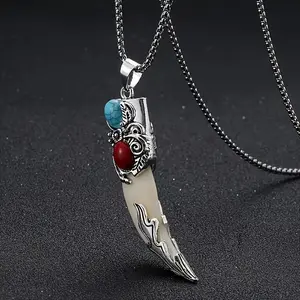 A vintage bohemian-style wolf tooth-shaped pendant necklace with turquoise inlay, suitable as a creative unisex gift for friends or as a Christmas present