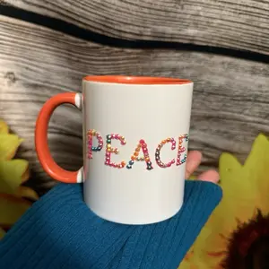 Peace of Rainbows Mug with Colorful Lettering and Orange Handle for Daily Use