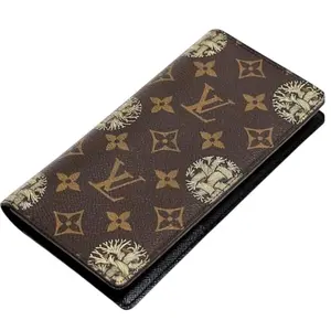 Pre-owned Louis Vuitton Coated Canvas Wallet Portefeuille Brazza long from a limited edition collaboration with British designer Christopher Nemeth.