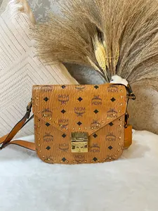 Pre-owned MCM messenger bag in classic cognac Visetos canvas. Features the iconic monogram 1919H0820