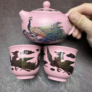 Hand painted peacock tea pot with matching cup set.H018