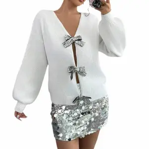 Women’s casual knit sweater with a bow detail and rhinestone embellishments, fashionable design, unique fit, soft and warm fabric, V-neck GARMENTARY