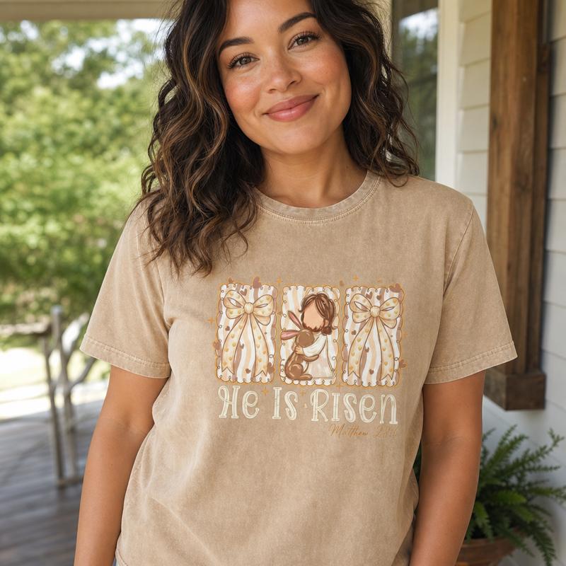 Women's Short-Sleeve Crew Neck Drop Shoulder Casual Christian Graphic T-Shirt - Shortsleeve, Graphic Print, Casual Wear Top with He Is Risen Jesus, Easter Bunny, Faith Bow Designs