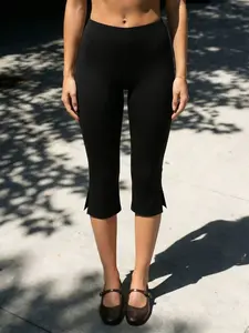 Women's Black Split-Hem Capri Leggings, High-Waisted Stretchy Slim-Fit Leggings, Suitable for Yoga, Everyday Casual Wear, and Sports/Fitness Activities.