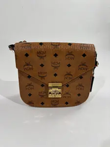 Pre-owned MCM Cognac brown Visetos coated canvas + natural cowhide trim Crossbody Bags Visetos Messenger Bag (9.1 × 8.3 × 3.5 inch) Cognac Brown Adjustable Strap Crossbody Handbag