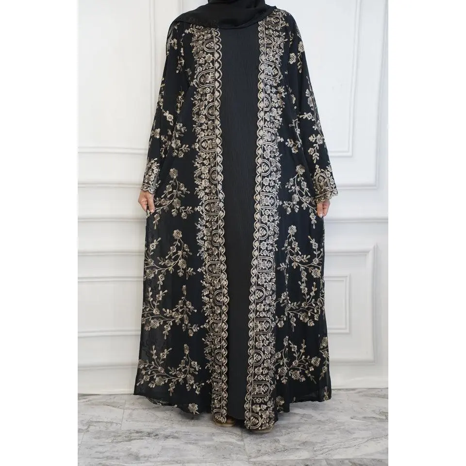 Beautifully embroidered Floral Abaya is available in 2 stunning colors Black on Black and Black with Champagne Embroidery . Comes as a 2-piece set with a matching inner dress, making it the perfect blend of style and comfort.