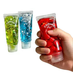 Glitter Jam Bottle Squishy Toy, Slow Rising TPR Squeeze with Fruit Charms, Stress & Anxiety Relief Fidget, Toothpaste Shaped Design, Lovely Birthday Gift for Girls & Adults