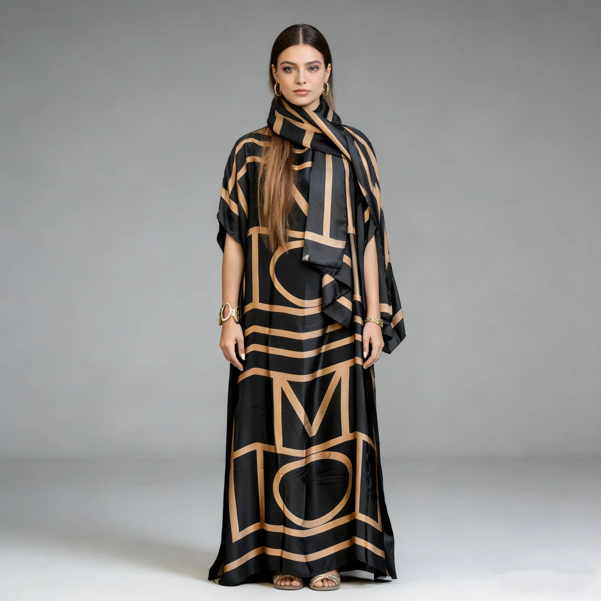 Women's luxurious black and gold geometric letter combination maxi dress, satin fabric loose kaftan robe, elegant dinner party outfit, versatile autumn and winter fashion item, bold and unique personality clothing paired with the same style scarf
