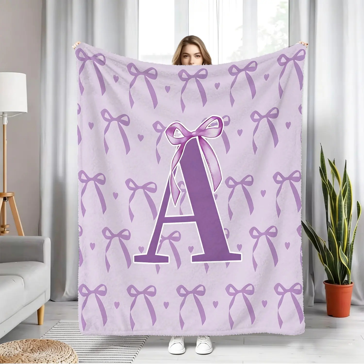 Purple Polyester Flannel Blanket With Bow and Letter Print. High-Definition Digital Printing Ensures Vibrant Colors. Solidly Crafted, Durable, and Resistant to Pilling. Fluffy, Soft, and Gentle, This Versatile and Warm Blanket Is Perfect for A Girly Look.