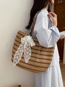 1pc A vacation style striped grass woven large capacity tote bag, paired with leather patchwork shoulder straps and lace bow hanging accessories, suitable for women's seaside travel and gentle atmosphere fashionable dressing scenes.