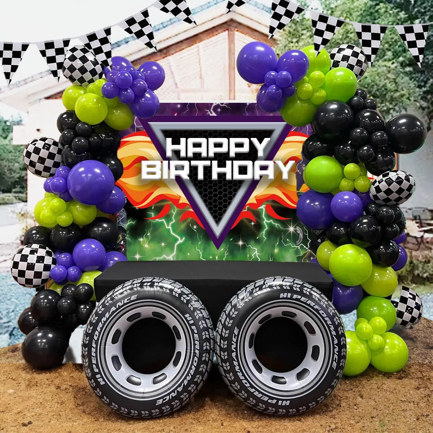 Truck Balloon Garland Kit featuring green, purple, black, and silver balloons with big wheels and checkered flags. Perfect for monster truck parties and 3rd or 4th birthday celebrations