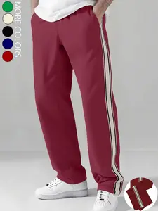 Men's straight-leg casual pants feature white stripe paneling on the sides and a drawstring waist. With a loose, comfortable casual style, they’re suitable for multiple occasions and work as year-round men’s trousers.