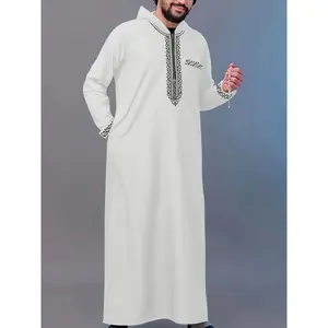 A piece of traditional Middle Eastern cultural attire Eid al-Adha festival garment Hooded black patterned embroidered faux-pocket embellished long-sleeved white robe Arab traditional cultural attire