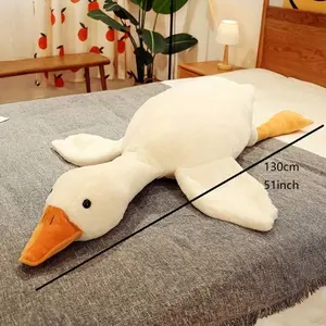 Cute Big White Goose Plush Pillow Toy! Large and irresistibly huggable, it's a favorite for both kids and adults. Suitable for all beds, offering coziness whether you cuddle or clamp it. A practical and sweet sleep companion.