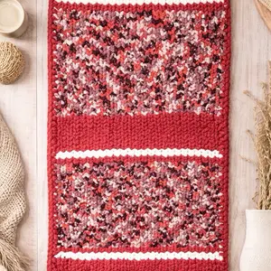 Chunky knit blanket in coral and cream