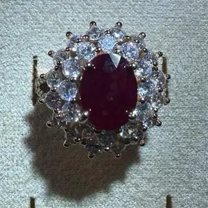 <PingEast Jewelry>Ruby Ring302/402--925 Sterling Silver Rose Gold–Plated Sunflower Ring, set with White Quartz and Moissanite accents. Features a 6×8 mm oval natural Burmese Pigeon Blood Ruby. Elegant and luxurious design. Comes with a certific