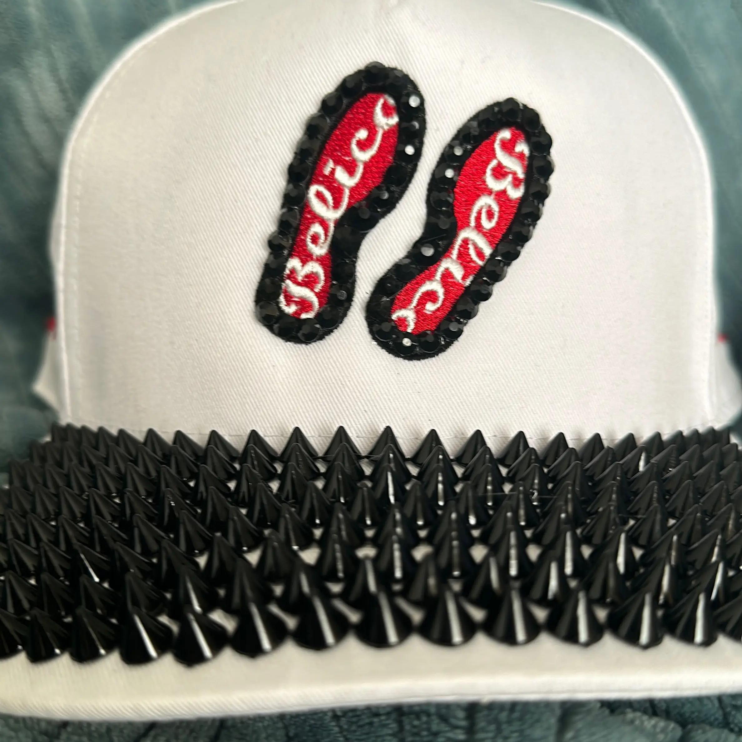 Red bottom belico snap back hat