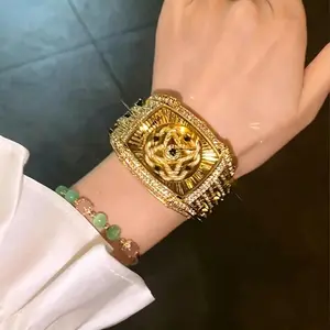 Luxury Diamond Gold Watch for Women  Gold Square Dial with Diamond-Encrusted Rotating Four-Leaf Clover Star Design, Fashionable, Sparkling & Versatile Timeless Classic Design, Includes Adjustment Tool