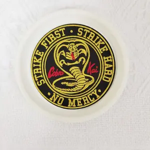 1PCS large-sized circular STRIKE FIRST STRIKE HARD NO MERCY embroidered fabric patch with a snake pattern badge in the middle, suitable for DIY decorative patch patches on hats, bags, shoes, and clothing. Durable material with back hot melt adhesive that
