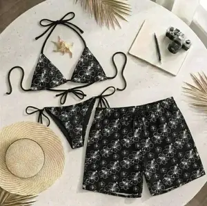 [Hot Summer 2026] - Matching swimsuit set including a black floral bikini and trendy patterned shorts, perfect for the beach.