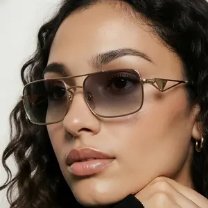 Pre-owned PRADA Sunglasses in a Gold Metal Frame with Tinted Lens