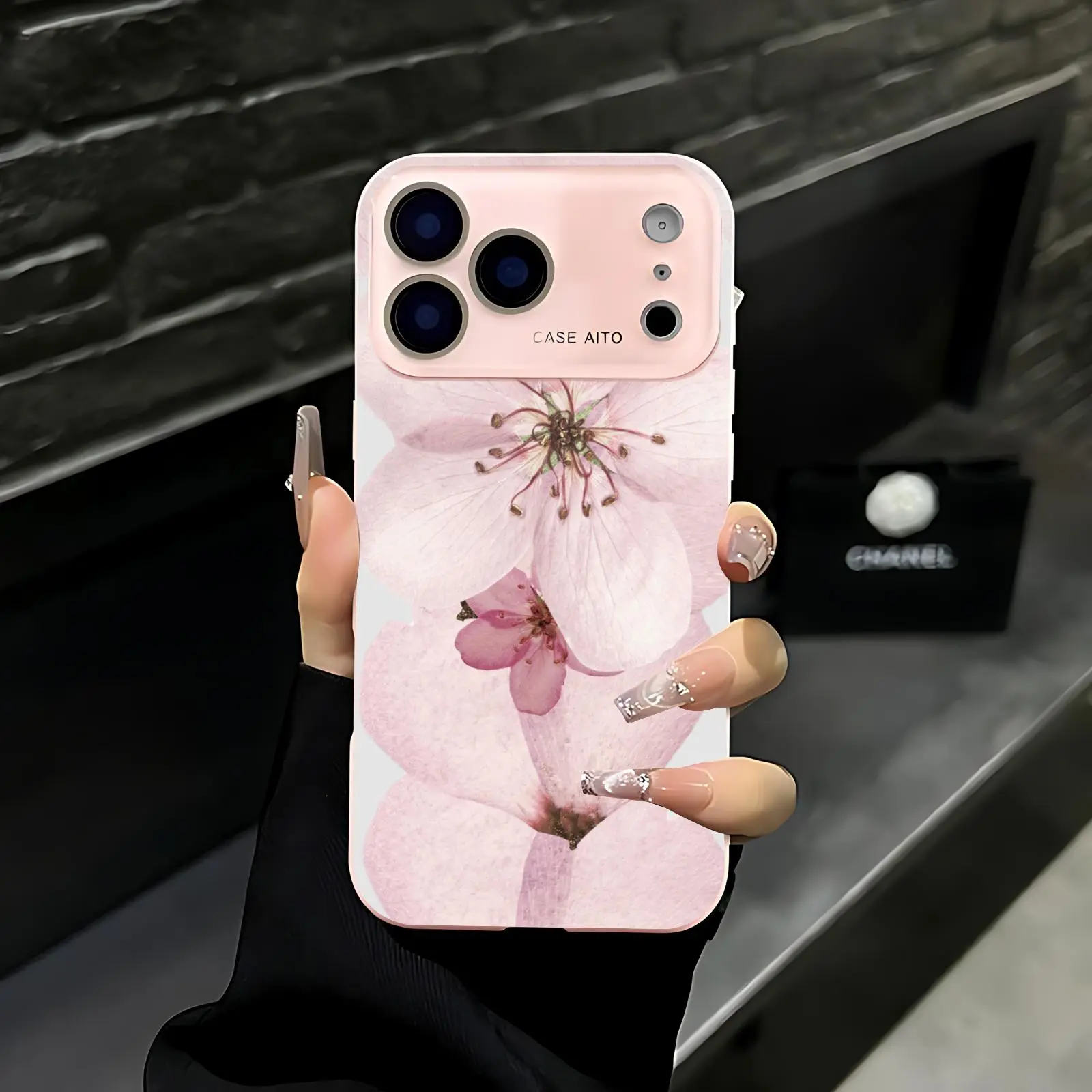 Light pink cherry blossom petal print phone case. Compatible with iPhone 17 Pro Max, 16 Pro Max, 15 Pro Max, and 14 Pro Max. Full lens protection. Also compatible with iPhone 15, 14, 13, and 12. Made of skin-friendly TPU material.