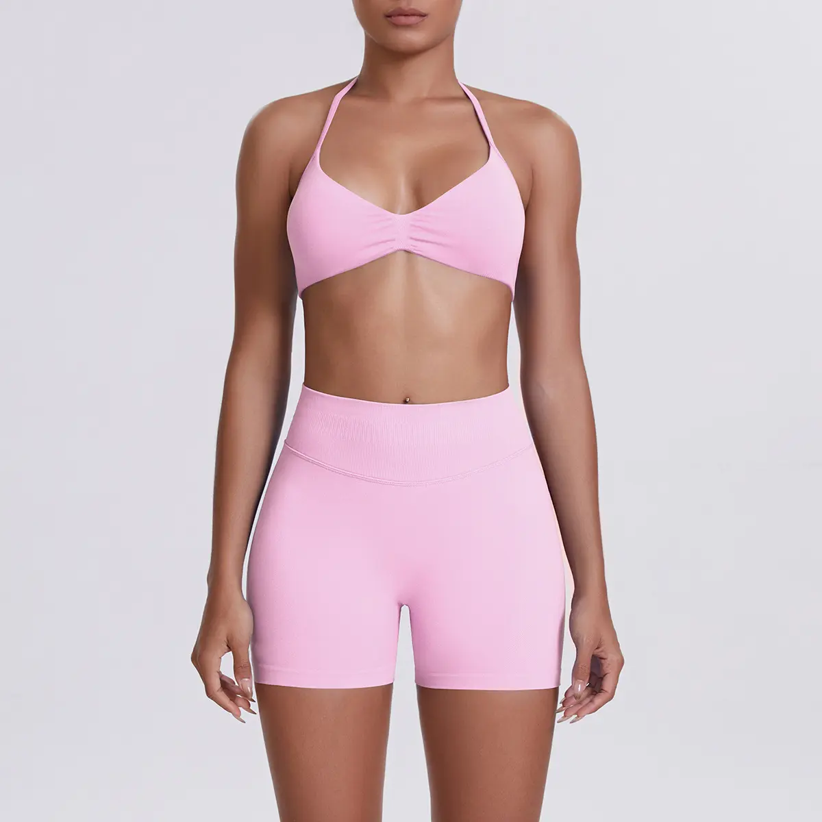 Modern Sleek Two Piece Workout Set Featuring Formfitting Halter Sports Bra and Compression Highwaist Biker Shorts Ideal for Pilates Strength Training and Casual Athleisure Wear
