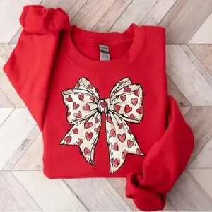Warm Valentine's Day heart-shaped bow sweatshirt - Retro Valentine's Day shirt with cute bow design, perfect girl gift and sweet holiday outfit.RAIMENTRY