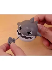 Pull-cord shark pendant with bared teeth, stress-relieving by pulling the cord, big fish eating small fish creative bag accessory, small shark keychain