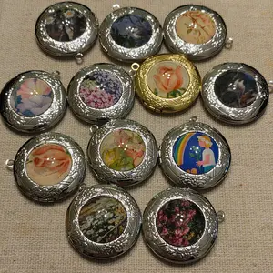 Lockets! Silver and gold tone with custom cabachon! Leather cord necklace!