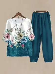 Two-piece top and bottom set - T-shirt + pants. Summer vacation wear for 2026. Plant print with flower pattern design. Round-neck relaxed T-shirt as an elegant top and casual long pants as the bottom set. Women's large-sized women's clothing #Set #Two-pie