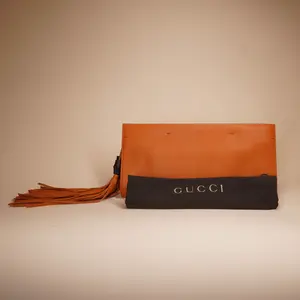 Pre-owned GUCCI Leather Clutches & Wristlets Orange Bamboo Tassel Clutch
