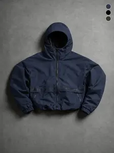 Men’s solid blue hooded jacket with letter print across the chest, wrinkle-resistant water-repellent fabric, full zip closure plus stitched zipper pockets, suitable for streetwear, commuting, and short outings.