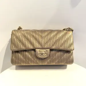 Pre-owned CHANEL Medium Classic Flap Bag with Bronze V stitch Pattern Elegant Everyday Use Versatile Design