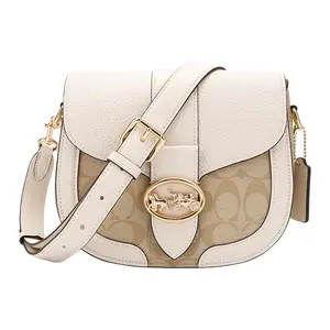 COACH Georgie 21 Saddle Bag – Women’s Small Crossbody Shoulder Bag with Metal Carriage Clasp, PVC and Leather, Beige and Light Khaki Monogram Print