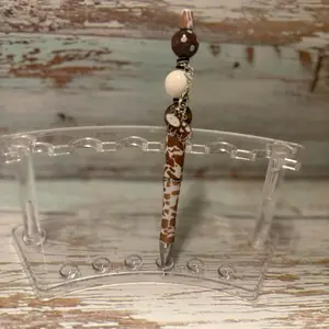 Brown and white cow themed pen